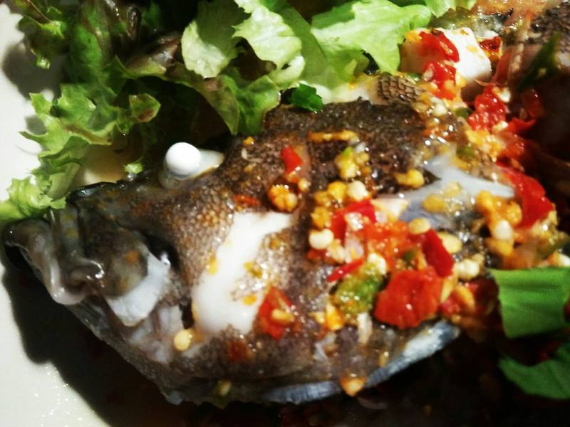 Steamed fish with fresh chilli, garlic and herbs.